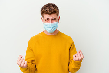 Young man wearing a mask for coronavirus isolated on white background cheering carefree and excited. Victory concept.