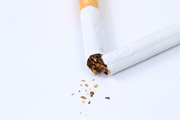 Broken cigarette on white background. Stop smoking concept.
