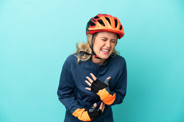 Young cyclist woman isolated on blue background smiling a lot