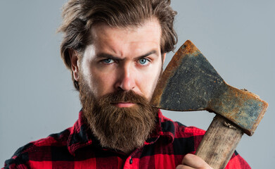 brutal man lumberjack with axe cut hair, barbershop
