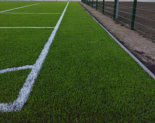 Artificial grass soccer field. Corner kick line of ball and a soccer field , football field , background texture