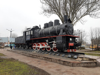 Fototapeta na wymiar Steam locomotive on the square