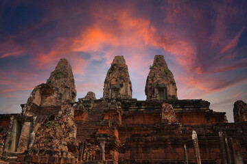 Naklejka premium Pre Rup Eastern Mebon Khmer architecture of Angkor wat Lost ancient Khmer city in the jungle in Siem Reap Cambodia.The majestic Hindu pyramid of the ancient empire.Sunset view of spires of temple