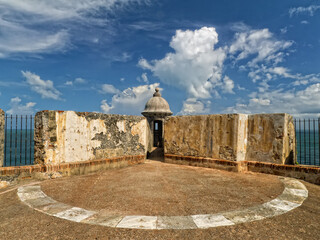 Fototapeta na wymiar Fortress wall and a beautiful blue sky at the El Morro in Old San Juan