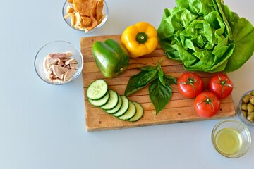 Healthy mediterranean ingredients with vegetables and chicken to make fresh nutritious salads and meals. Photo concept, background, table top view, copy space, healthy lifestyle