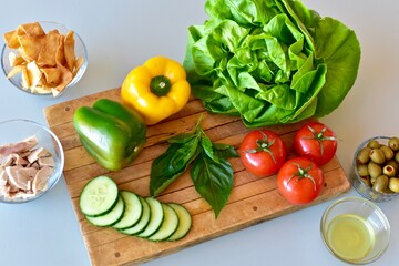 Healthy vegetables and chicken for preparing homemade meals with the Mediterranean diet. Fresh food background, photo concept, flat lay, copy space, whole foods