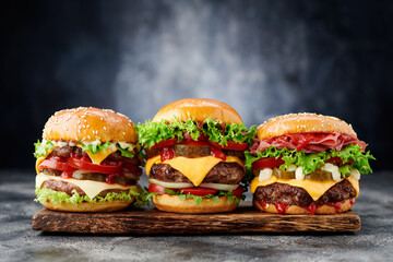 Fresh tasty burger on dark background