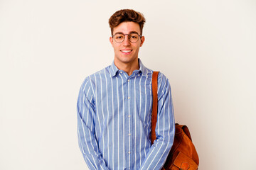 Young student man isolated on white background happy, smiling and cheerful.