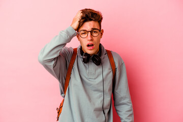 Young student man isolated on pink background tired and very sleepy keeping hand on head.