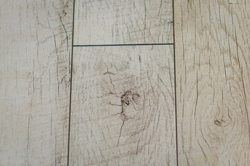 The flooring is made of wood-colored tiles.