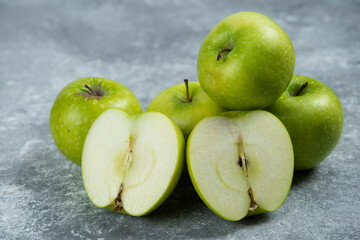 Bunch of green apples on marble background