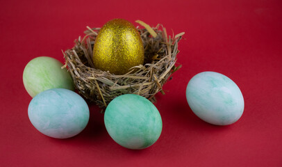 image of festive Easter eggs and pussy willow branches on the table close-up.