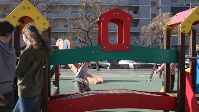 Children of different ages play on the playground