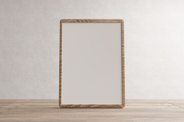 Empty wooden frame with space for inscription against a white wall. Wooden frame. 3D rendering image