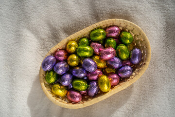 multicoloured chocolate easter candies in a basket