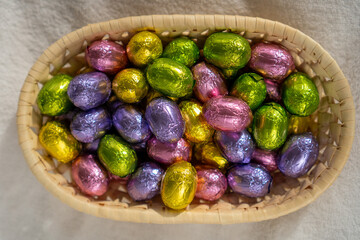 multicoloured chocolate easter candies in a basket