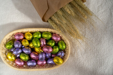 chocolate Easter sweets in a basket and dried flowers