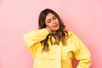 Young caucasian woman isolated having a neck pain due to stress, massaging and touching it with hand.