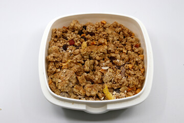 Bowl full of muesli in white background