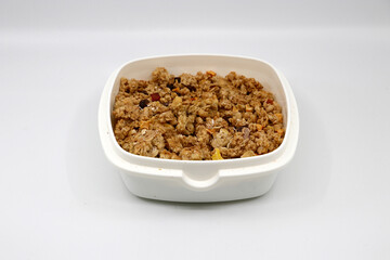 Bowl full of muesli in white background