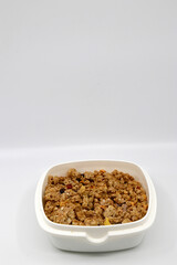 Bowl full of muesli in white background