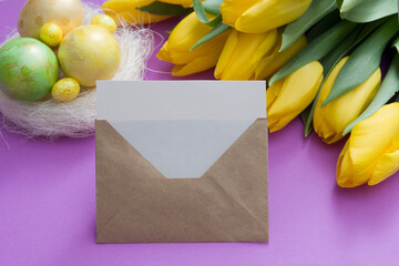 Happy Easter blank card mock up with bouquet of yellow tulips and Easter nest with eggs