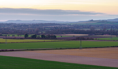 Fototapeta na wymiar a scenic landscape view across Pewsey Vale and Pewsey Village in Wiltshire, North Wessex Downs AONB