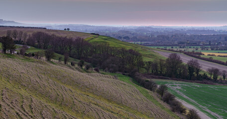 a scenic landscape view across Pewsey Vale and Pewsey Village in Wiltshire, North Wessex Downs AONB