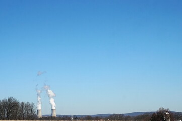Cement Cooling Towers with Bright Blue Sky