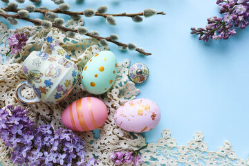 Easter greeting card. Easter eggs, flowers and willow twigs 