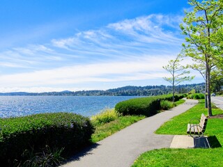 Walkway by the ocean along the Lochside trail in Sidney BC in the spring spring