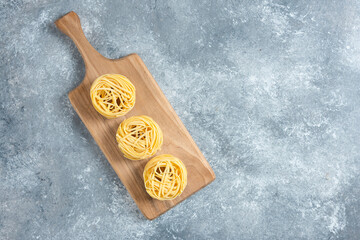 Plate of noodles and spaghetti on marble background