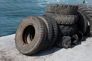 Old truck tires on the coast.