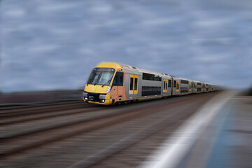 Fototapeta na wymiar Commuter train approaching a train station Sydney NSW Australia