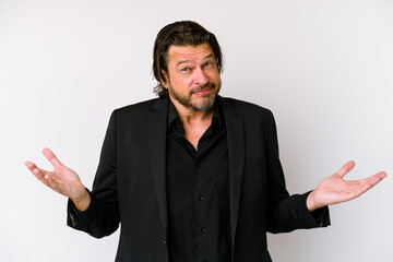 Middle age business dutch man isolated on white background doubting and shrugging shoulders in questioning gesture.