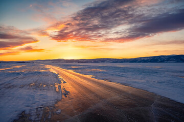 Fototapeta na wymiar Road, crossing a frozen lake, highway
