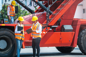 Obraz na płótnie Canvas Portrait Of man woman Engineers and workers inspecting and meeting in front of heavy machine vehicle car. Business people with confident and smart working in shipping transport industry.