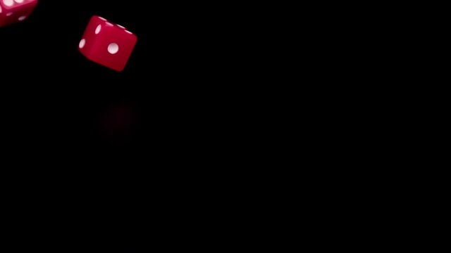Rolling red dice in ultra slow motion landing on six and five for a total of eleven, 1000fps