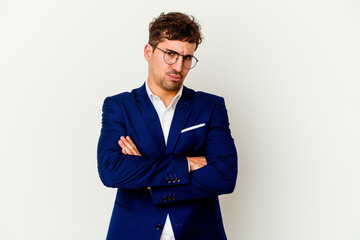 Young business caucasian man isolated on white background frowning face in displeasure, keeps arms...