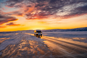 A car crossing a frozen lake