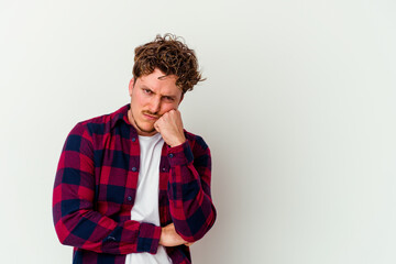 Young caucasian man isolated on white background who feels sad and pensive, looking at copy space.