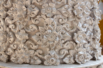 Traditional Thai style stucco on the wall in temple, Thailand.