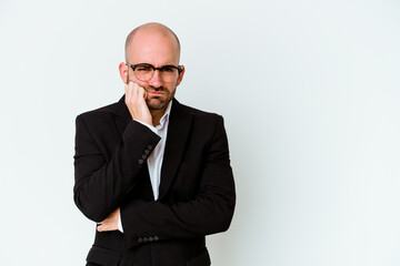 Young business caucasian bald man isolated on blue background who feels sad and pensive, looking at copy space.