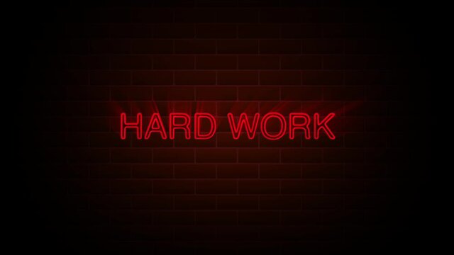 Hard work text on neon sign. Night bright advertisement. Motion graphics. 