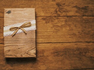 A gift box placed on an old wood.