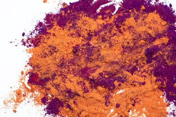 Multi-colored abstract powder explosion on white background.