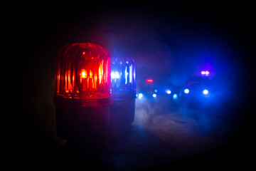 Police car blue and red round vintage siren in dark. Rotating retro style police siren in dark.