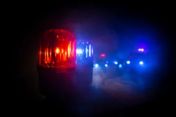 Foto op Canvas Police car blue and red round vintage siren in dark. Rotating retro style police siren in dark. © zef art