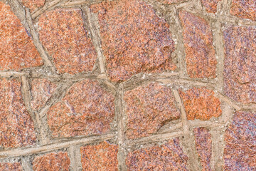 Red and brown stone cobblestone wall texture background