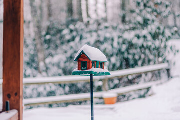 bird house in winter covered in snow